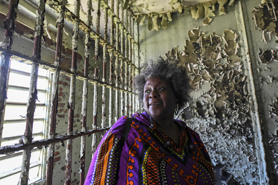 In this Feb. 29, 2020, photo, Jamida Orange looks around the Perry County Jail cell in Marion, Ala., where her father, the Rev. James Orange, a project coordinator for the Southern Christian Leadership Conference, was held in 1965 after his arrest while organizing a voter registration drive. When students began skipping school to join the marches, authorities arrested Orange on Feb. 18, 1965, for contributing to the delinquency of minors. (AP Photo/Julie Bennett)