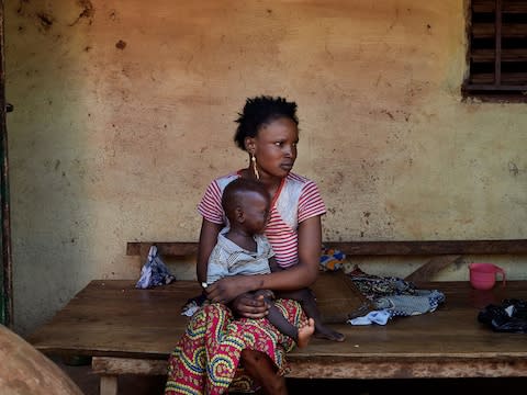 Sanaba, 16, from Doko, Guinea, gave birth to her first son ten months ago - Credit: Francesco Brembati