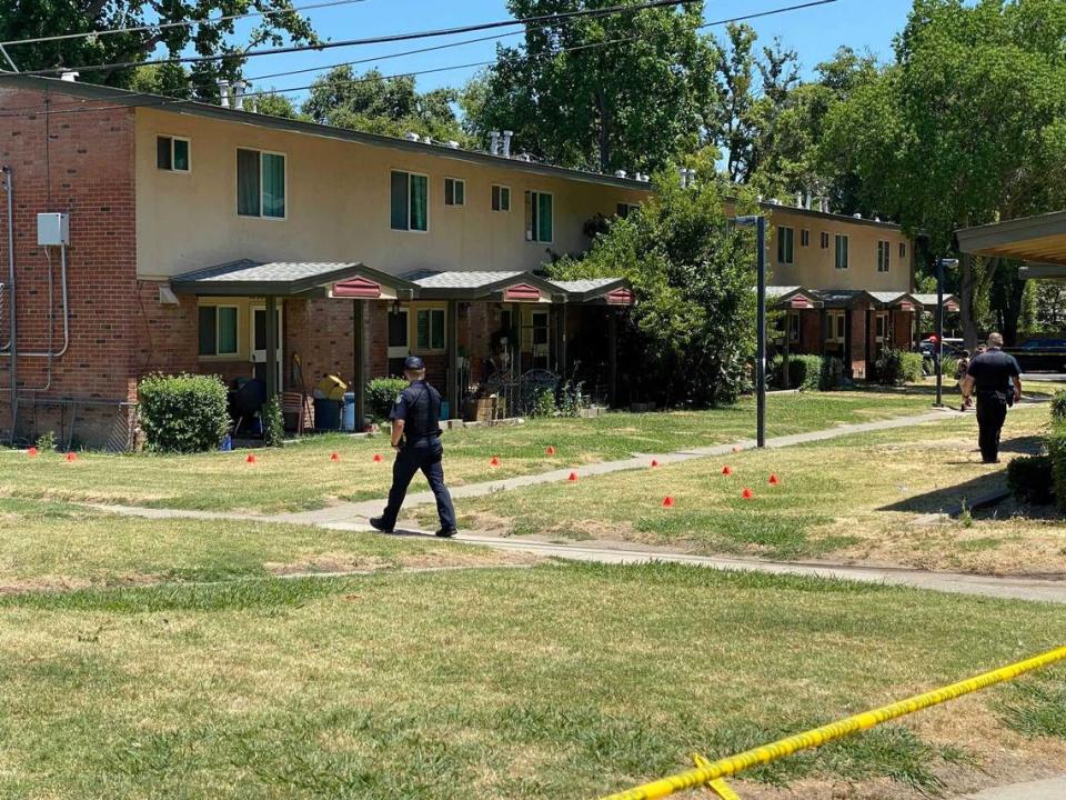 Evidence markers show an area where a shooting took place Sunday, June 23, 2024, between apartment rows in the Marina Vista affordable housing complex in the Upper Land Park section of Sacramento. Police say one man was hospitalized after he was shot.