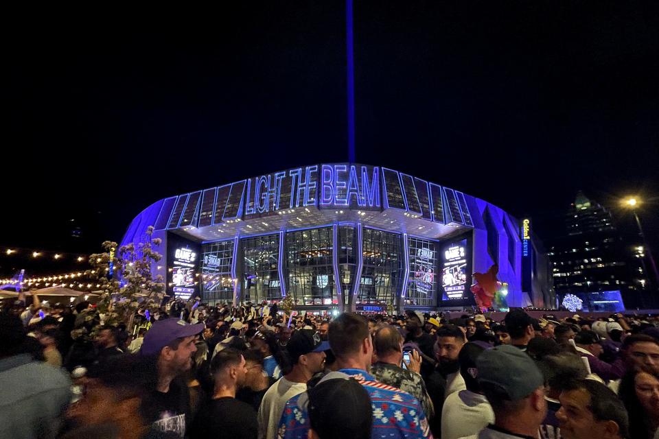 Game 1: Fans walk outside the Golden 1 Center after the beam was lit following the Sacramento Kings' victory over the Golden State Warriors.