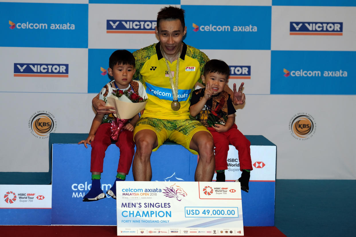 Lee Chong Wei poses with his sons Kingston Lee and Terrence Lee after winning  in the single final against He Kento Momota of Japan during Celcom Axiata Badminton Malaysia Open 2018 at Bukit Jalil Stadium, Kuala Lumpur on July 1, 2018.  (PHOTO: Getty Images)