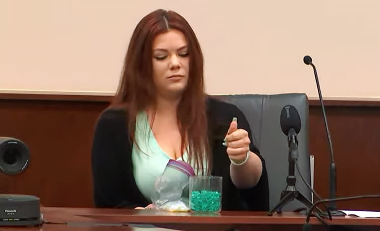 Alexis Bailey drops 114 stones into a jar to represent each time Aiden Fucci stabbed her sister Tristyn. (First Coast News)