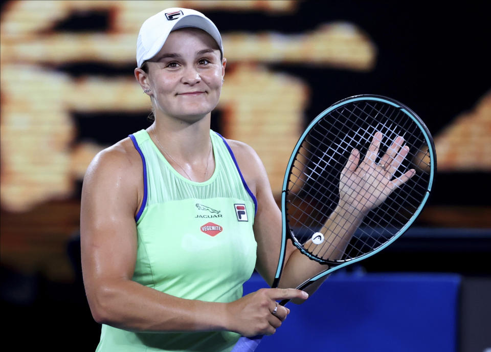 Australia's Ashleigh Barty reacts after defeating Lesia Tsurenko of Ukraine in their first round singles match the Australian Open tennis championship in Melbourne, Australia, Monday, Jan. 20, 2020. (AP Photo/Lee Jin-man)