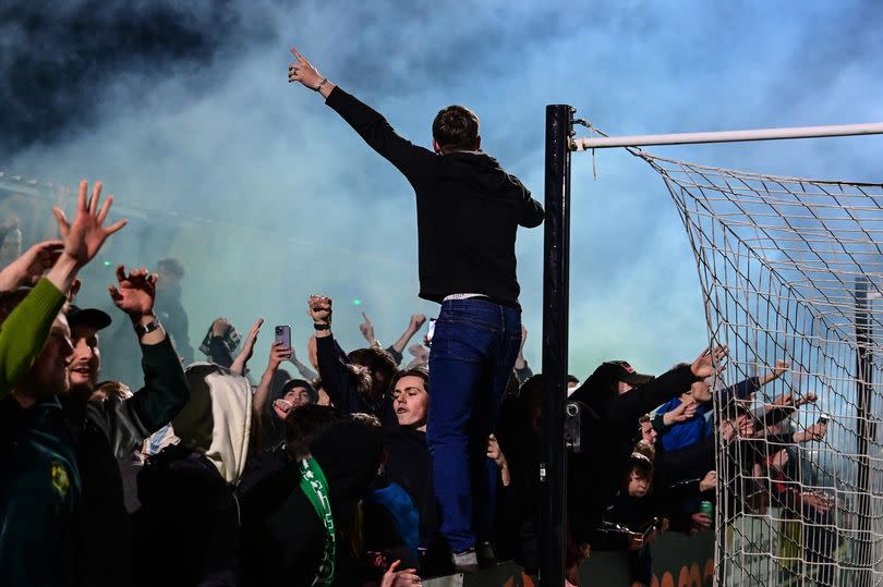 Goal celebrations for Yeovil Town fans after a goal from Alex Fisher of Yeovil Town during the National League South match between Truro City and Torquay United at Meadow Park, Gloucester