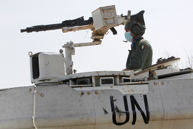 FILE PHOTO: A UN peacekeeper (UNIFIL) sits in a UN armoured vehicle in Naqoura, near the Lebanese-Israeli border