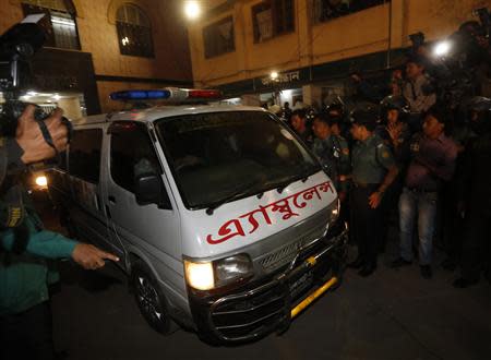 One of a convoy of three ambulances leave the central jail in Dhaka December 12, 2013. REUTERS/Andrew Biraj