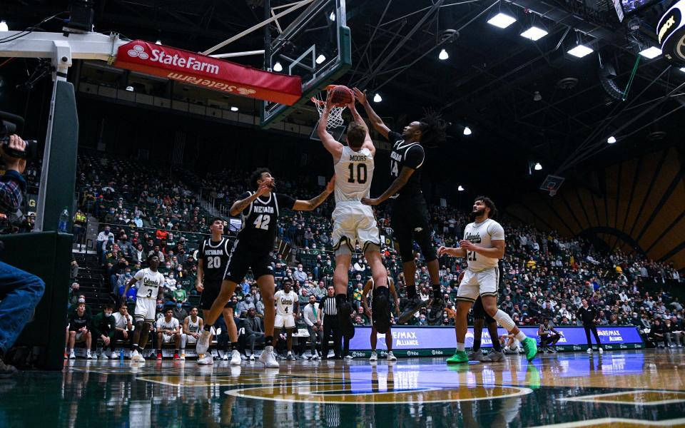 Colorado State forward James Moors (10) gets fouled on his dunk attempt during CSU's 77-66 win over Nevada.