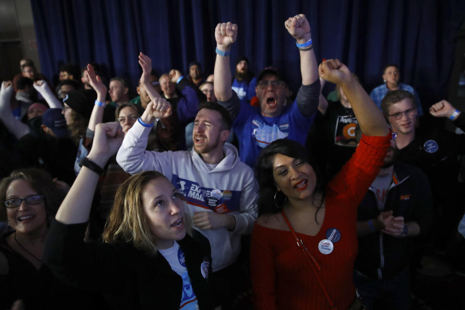 Supporters of Democratic presidential candidate Sen. Bernie Sanders, I-Vt., wait for results at a caucus night campaign rally in Des Moines, Iowa, Monday, Feb. 3, 2020. (AP Photo/Matt Rourke)