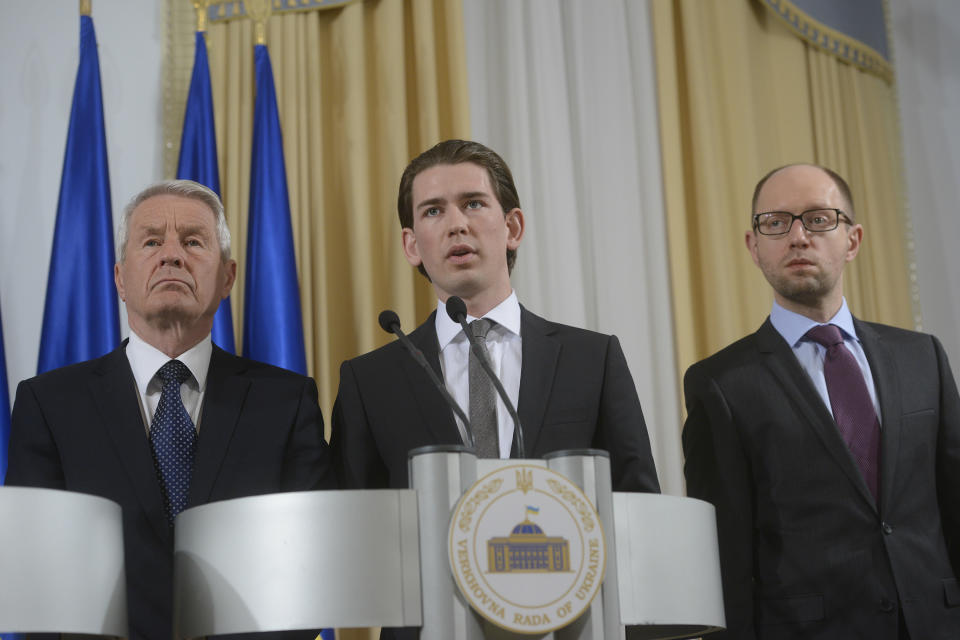 Austrian Foreign Minister Sebastian Kurz, center, Ukrainian Prime Minister Arseniy Yatsenyuk, right, and Secretary-General of the Council of Europe Thorbjorn Jagland address to media in Kiev, Ukraine, Monday, March, 10, 2014. (AP Photo/Andrew Kravchenko, pool)