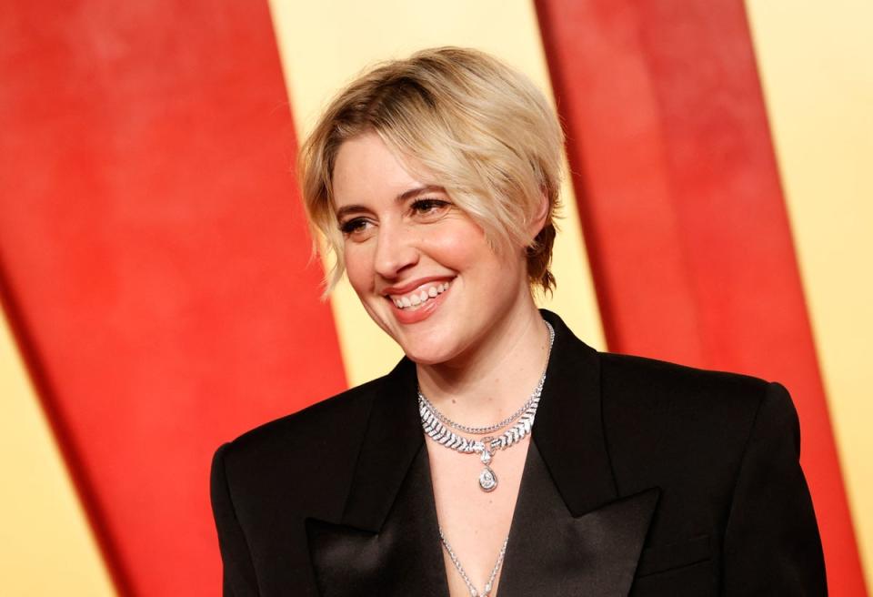 Greta Gerwig posing on the red carpet at the Vanity Fair Oscar party (Getty)