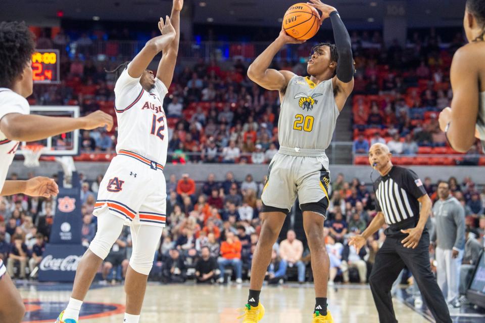 Alabama State Hornets guard TJ Madlock (20) takes a jump shot as Auburn Tigers take on Alabama State Hornets at Neville Arena in Auburn, Ala., on Friday, Dec. 22, 2023.