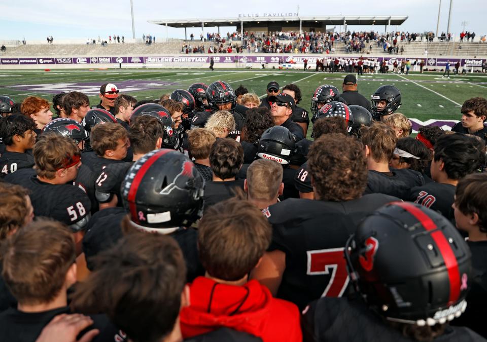 Shallowater coach Rodney Vincent talks to his players after the game against Whitesboro, Friday, Nov. 26, 2021, at Wildcat Stadium in Abilene, Texas.