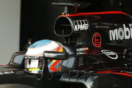 McLaren Formula One driver Fernando Alonso of Spain leaves his garage during the fourth testing session ahead the upcoming season at the Circuit Barcelona-Catalunya in Montmelo, Spain, February 25, 2016. REUTERS/Sergio Perez