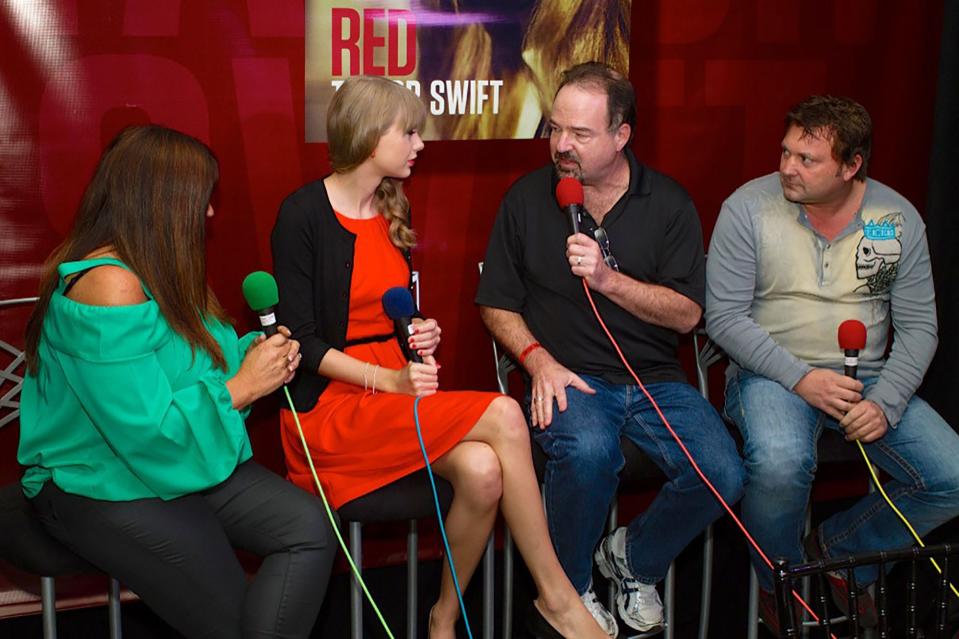Taylor Swift speaks with WYCD-FM's Dr. Don, second from right, Steve Grunwald, right, and Rachael Hunter, left, in 2012.