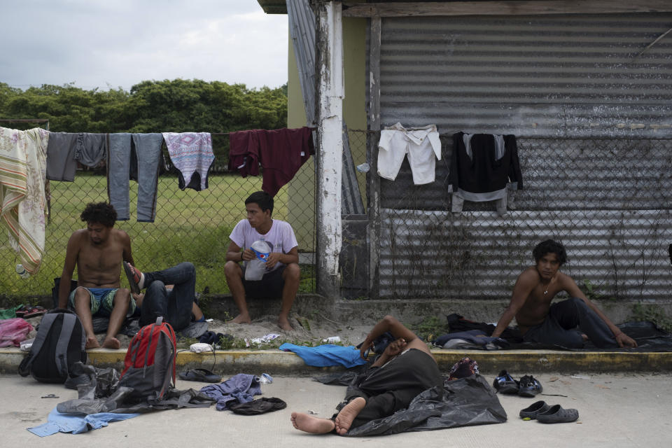 Migrants rest in Ulapa, Chiapas state, Mexico, Saturday, Oct. 30, 2021. The migrant caravan heading north in southern Mexico has so far been allowed to walk unimpeded, a change from the Mexican government’s reaction to other attempted mass migrations. (AP Photo/Isabel Mateos)