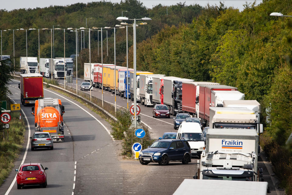 Lorries queue on the A2 near Dover in Kent. Credit: Getty.