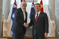 Chinese Premier Li Qiang and Australia's Prime Minister Anthony Albanese shake hands at Parliament House in Canberra, Australia, Monday, June 17, 2024. Li, Albanese and senior ministers of both administrations met at Parliament House on Monday to discuss thorny issues, including lingering trade barriers, conflict between their militaries in international waters and China's desire to invest in critical minerals. (Mick Tsikas/Pool Photo via AP)