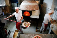 Pizza is prepared inside the Apollo Pizzeria, in London, Britain, January 22, 2019. REUTERS/Henry Nicholls