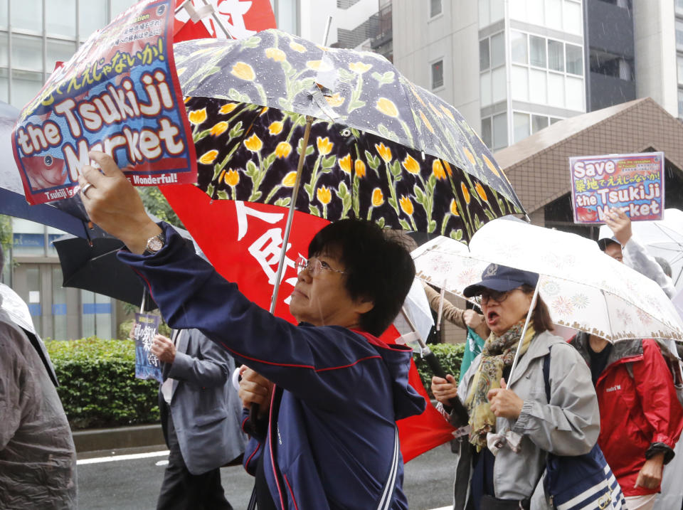 In this Sept. 29 , 2018, photo, people protest against the move of Tsukiji fish market during a rally in Tokyo. Japan's famed Tsukiji fish market is closing down on Saturday, Oct. 6, 2018 after eight decades, with shop owners and workers still doubting the safety of its replacement site. (AP Photo/Yuri Kageyama)