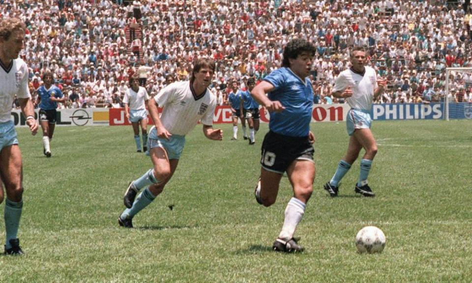 Maradona runs past Terry Butcher and Terry Fenwick on his way to scoring his second goal against England in 1986