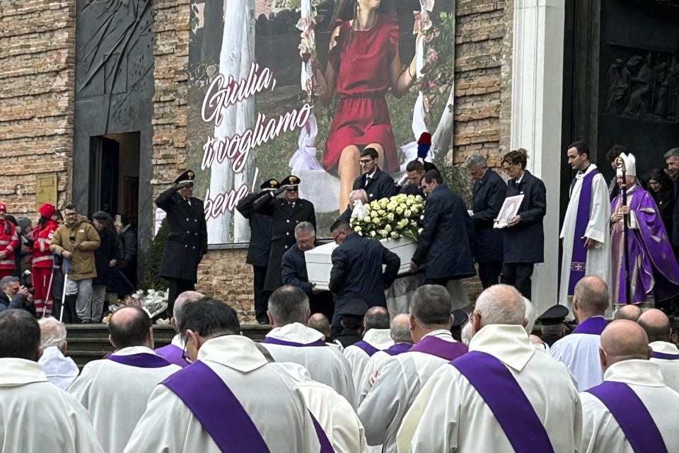 Pallbearers carry the coffin of Giulia Cecchettin during her funeral, at the Church of Santa Giustina in Padua, Italy, Tuesday Dec. 5, 2023. Mourners gathered at the Church of San Giustina in Padua for the funeral of Giulia Cecchettin, the 22-year-old killed by her former boyfriend, 21-year-old Filippo Turetta, on Nov. 11. (Lucrezia Granzetti/LaPresse via AP)