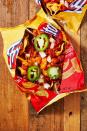 <p>Halloween is a day for fun, and this on-the-go Frito Pie recipe embodies just that.</p><p>Get the recipe from <a href="https://www.delish.com/cooking/recipe-ideas/a28914527/frito-pie-recipe/" rel="nofollow noopener" target="_blank" data-ylk="slk:Delish;elm:context_link;itc:0;sec:content-canvas" class="link ">Delish</a>.</p>