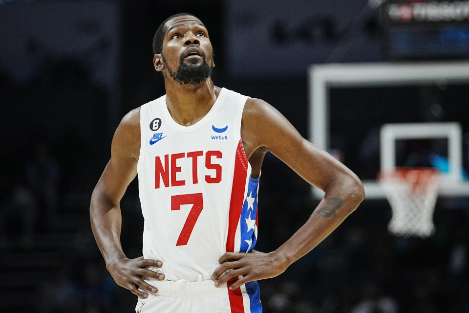 Brooklyn Nets forward Kevin Durant (7) looks at the clock during the first half of an NBA basketball game against the Charlotte Hornets, Saturday, Nov. 5, 2022, in Charlotte, N.C. (AP Photo/Rusty Jones)