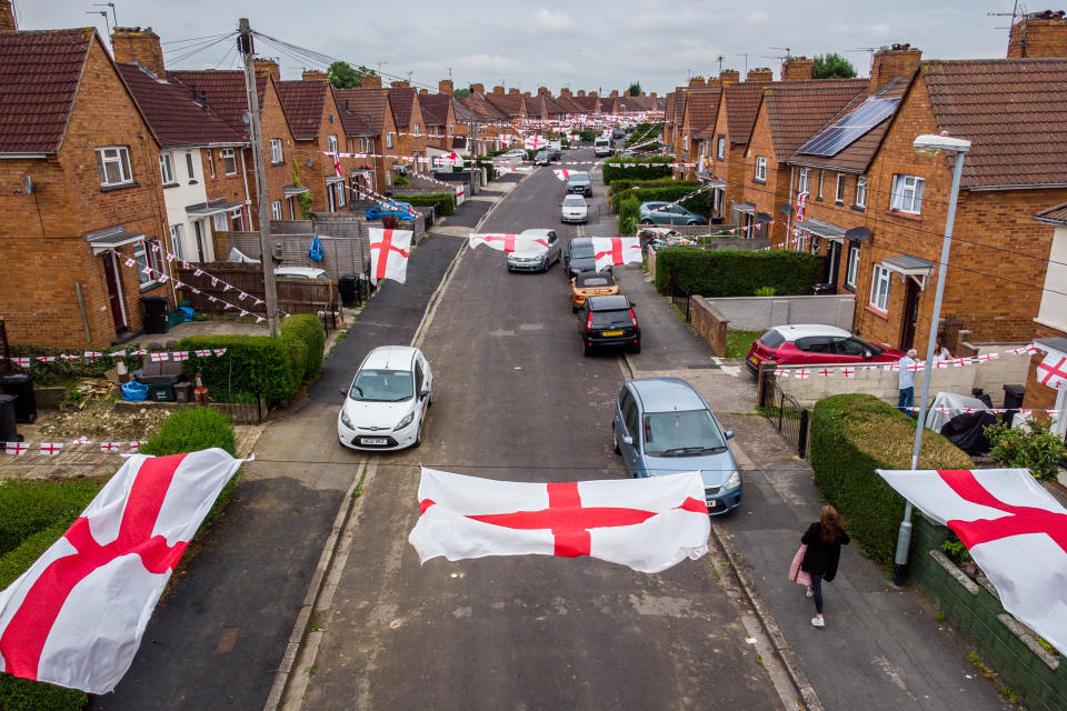 <p>England flags hang across the street in Torrington Avenue, Knowe, Bristol, where residents are showing their support for England during the Euro 2020 tournament. Picture date: Thursday June 24, 2021.</p>
