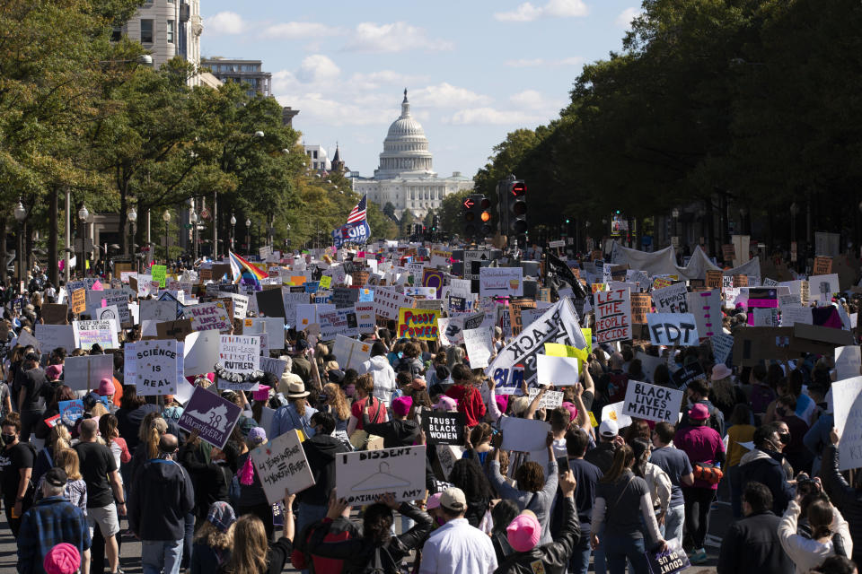 With the US Capitol in the background demonstrators march on Pennsylvania Avenue 