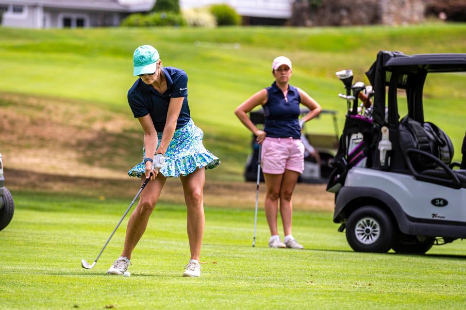 Isabelle Engelsted uses an iron from the fairway on hole 13 at the CCNB Women's Fourball Tournament.