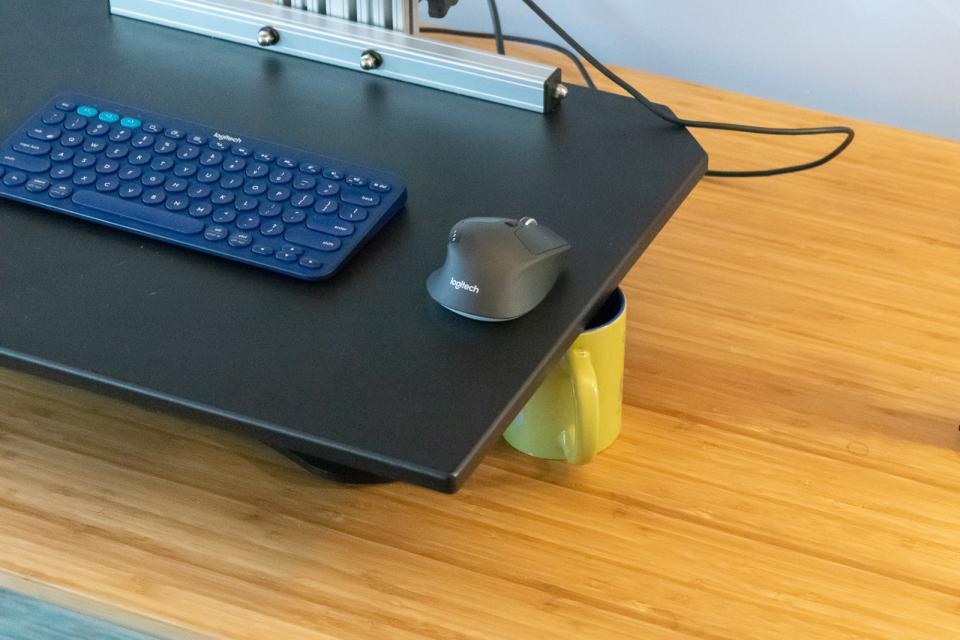 Standing desk converters