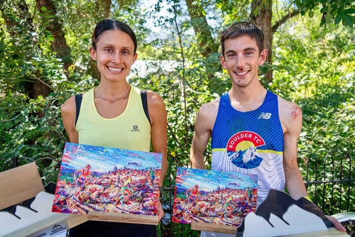 <span class="article__caption">Pikes Peak Marathon winners <span>Kristina Mascarenas and Jonathan Aziz show off their race trophies and the paintings created by local artist David V. Gonzales for this year’s race poster. </span>Photo Credit: Peter Maksimow</span>