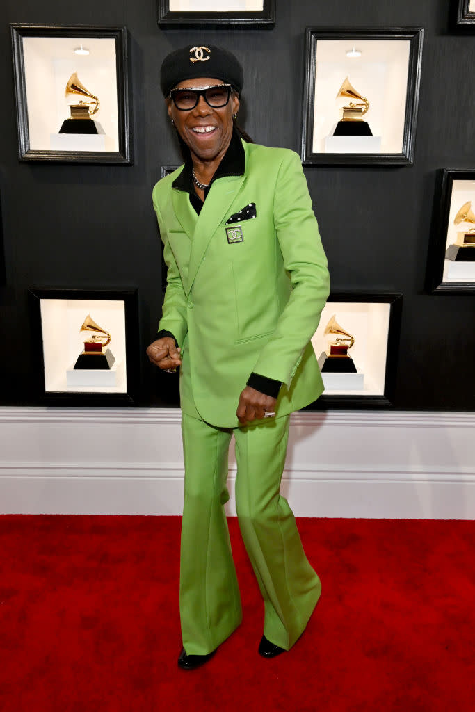 Nile Rodgers in lime-green suit and Cartier cap.