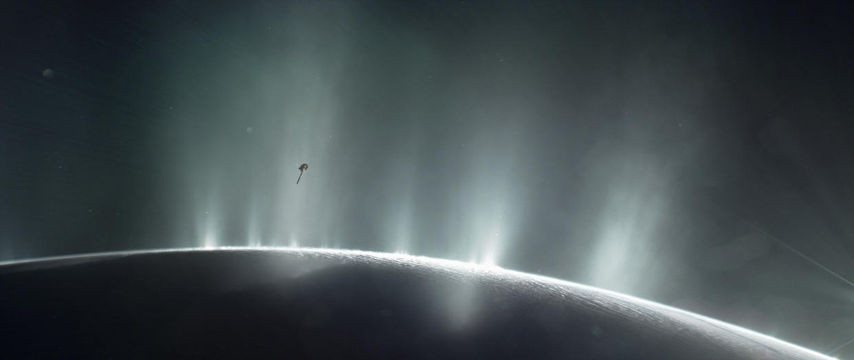 NASA's Cassini spacecraft is shown diving through the plume of Saturn's moon Enceladus, in 2015, in this photo illustration.  NASA/JPL-Caltech/Handout via REUTERS    ATTENTION EDITORS - THIS IMAGE WAS PROVIDED BY A THIRD PARTY. EDITORIAL USE ONLY.