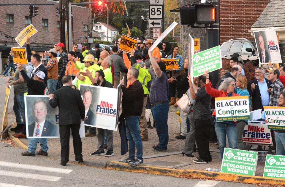 Supporters of Second Congressional district incumbent Democratic U.S. Rep. Joe Courtney, outgoing state Rep. Mike France (Republican candidate), and Green Party candidate Keven Blacker, Oct. 12, 2022 before their debate at the Garde Arts Center in New London.