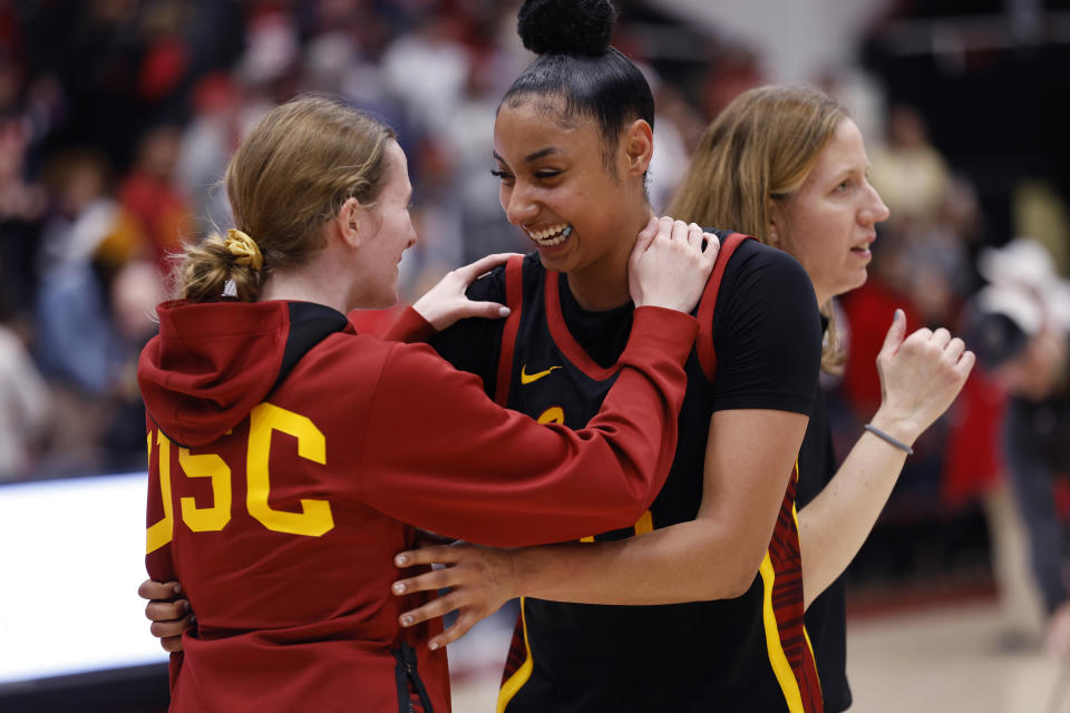 Southern California guard JuJu Watkins (12) celebrates win with guard India Otto (2) after an NCAA college basketball game against Stanford on Friday, Feb. 2, 2024 in Stanford, Calif. (AP Photo/Josie Lepe)