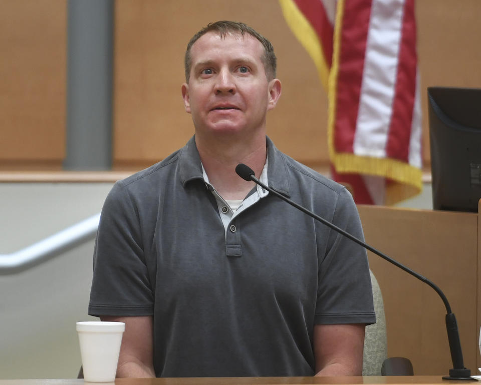 Robbie Parker, father of deceased Sandy Hook Elementary School student Emilie Parker, describes being confronted on the street by a follower of Infowars conspiracy theories during his testimony in Alex Jones' defamation trial at Superior Court in Waterbury, Conn., on Thursday, Sept. 29, 2022. (Brian A. Pounds/Hearst Connecticut Media via AP, Pool)