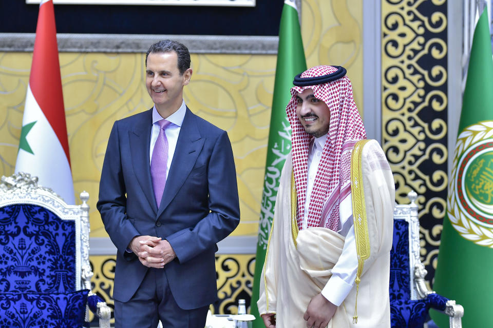 In this photo provided by Saudi Press Agency, SPA, Syrian President Bashar Assad, is accompanied by Prince Bandar Bin Sultan, deputy governor of Makkah, upon his arrival at Jeddah airport, Saudi Arabia, Thursday, May 18, 2023, ahead of the Arab summit. (Saudi Press Agency via AP)