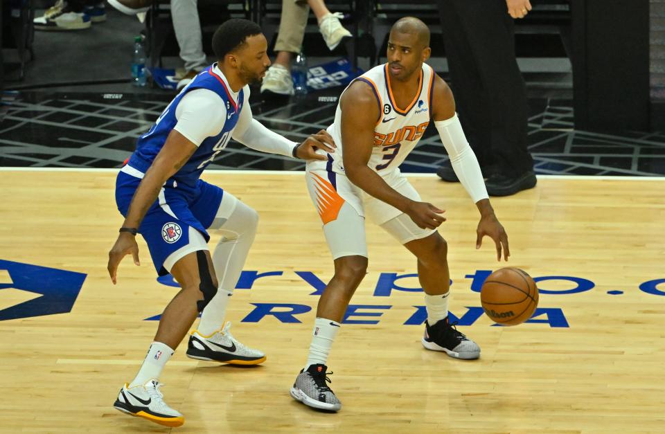 Apr 20, 2023; Los Angeles, California, USA; Los Angeles Clippers guard Norman Powell (24) guards Phoenix Suns guard Chris Paul (3) in the first quarter at Crypto.com Arena. Mandatory Credit: Jayne Kamin-Oncea-USA TODAY Sports