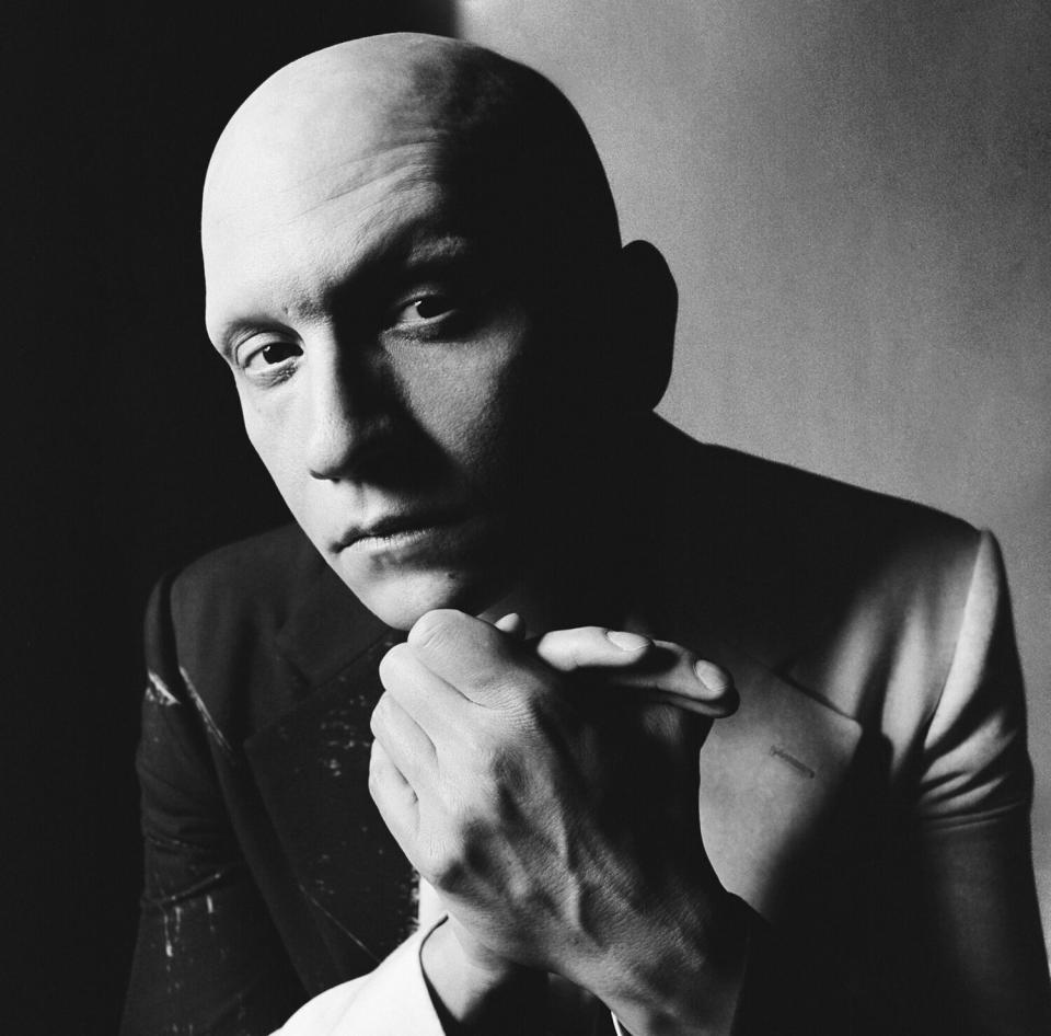 A black-and-white portrait of Anthony Carrigan