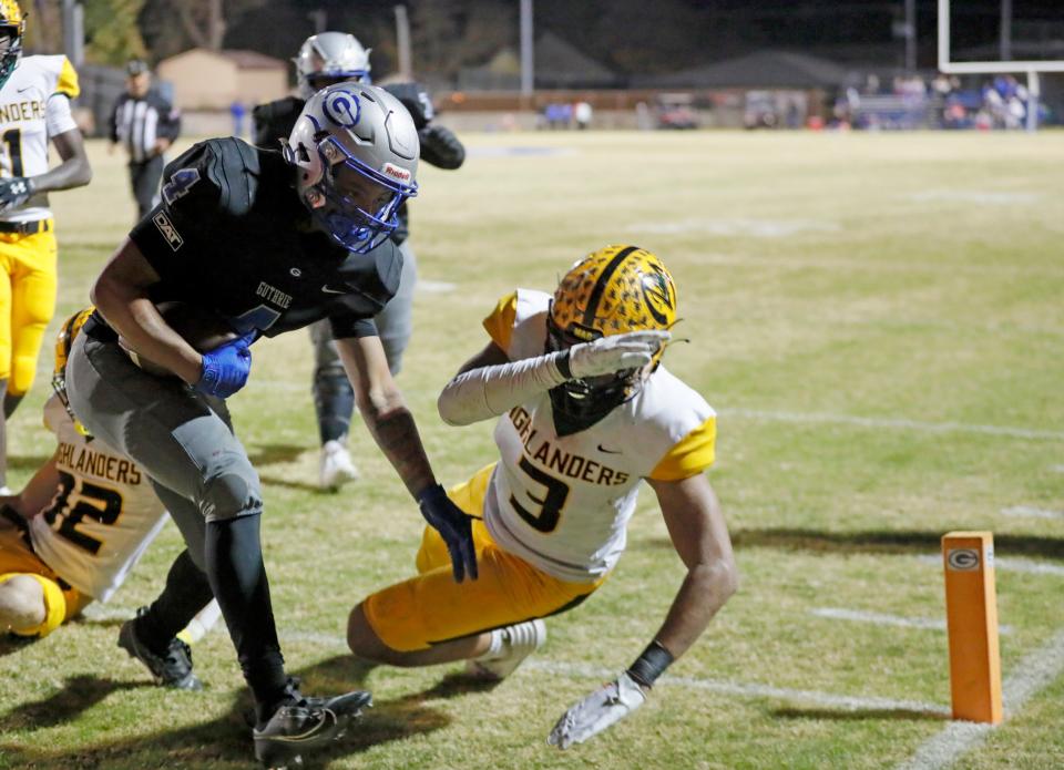 Guthrie's Jaylen Harper scores a touchdown as Lawton MacArthur's Adam Auston defends during a Class 5A playoff game Nov. 10 in Guthrie.