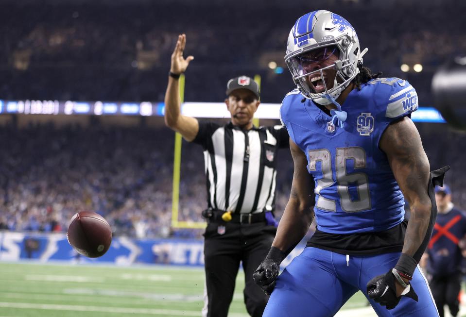 Jahmyr Gibbs #26 of the Detroit Lions celebrates a touchdown during the NFC Divisional Playoff game at Ford Field on January 21, 2024.