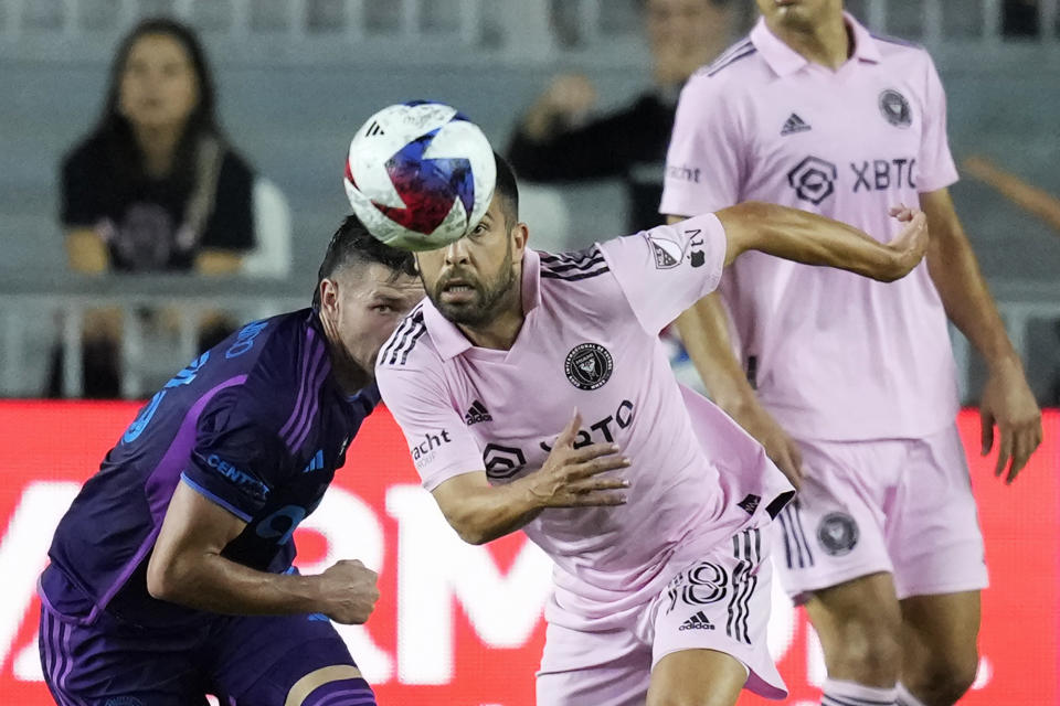 Inter Miami defender Jordi Alba (18) races for a ball pursued by Charlotte FC midfielder Brandt Bronico (13) during the second half of an MLS soccer match, Wednesday, Oct. 18, 2023, in Fort Lauderdale, Fla. (AP Photo/Rebecca Blackwell)