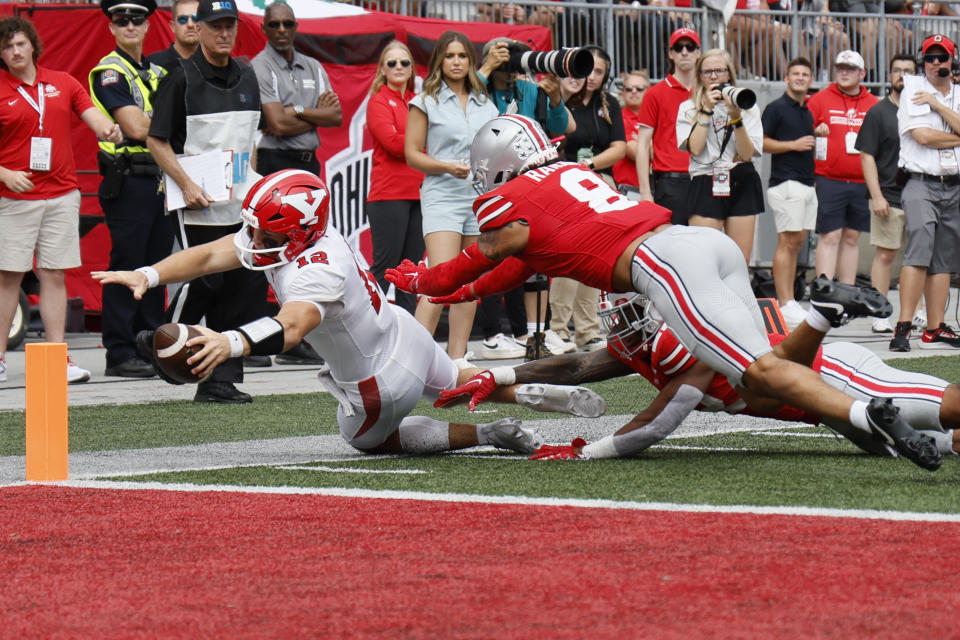 Youngstown State quarterback Beau Brungard, left, is forced out of bounds short of the goal line by Ohio State defensive back Lathan Ransom during the first half of an NCAA college football game Saturday, Sept. 9, 2023, in Columbus, Ohio. (AP Photo/Jay LaPrete)