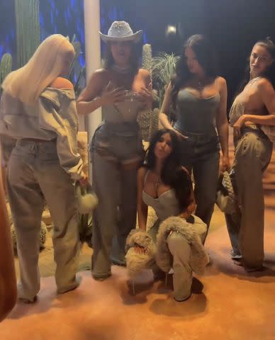<p>kim kardashian/instagram</p> Khloé Kardashian surrounded by her party guests