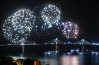 Fireworks light up the skies at the construction site of the Peljesac Bridge in Komarna, Croatia, Thursday, July 29, 2021. European Union-funded Peljesac Bridge in southern Croatia that has been built by a Chinese state-owned company was opened late Wednesday. The bridge was designed to connect two swaths of Adriatic Sea coastline and passes over a small stretch of Bosnia's territory. (AP Photo)