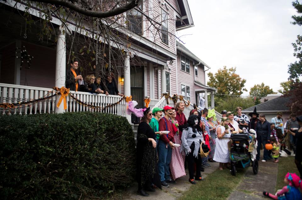 Adult costume contest participants gather for a photo at the Fourth and Gill neighborhood's Halloween party in Knoxville, Wed. Oct. 31, 2018.