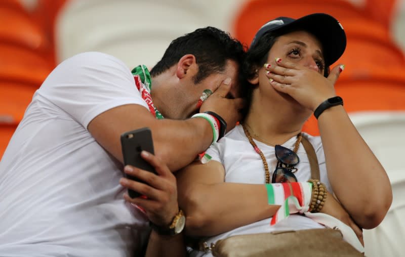 <p>Iran fans look dejected after the match. REUTERS/Ivan Alvarado </p>