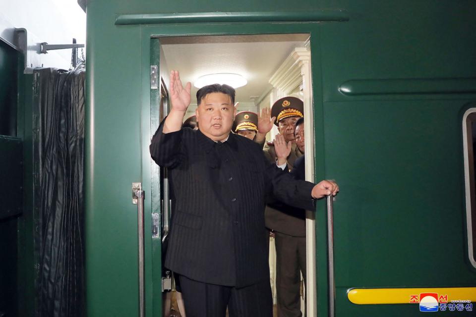 This picture taken on September 10, 2023 and released from North Korea's official Korean Central News Agency (KCNA) on September 12, 2023 shows North Korea's leader Kim Jong Un (C) waving as he departs by train from Pyongyang for a visit to Russia.