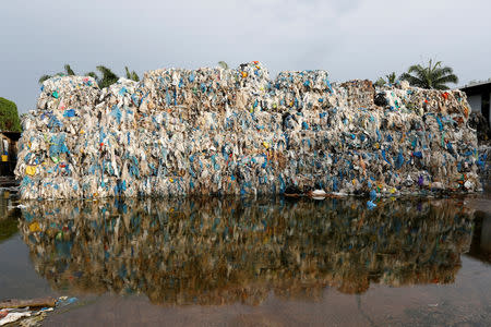 Plastic waste piled outside an illegal recycling factory in Jenjarom, Kuala Langat, Malaysia October 14, 2018. Picture taken October 14, 2018. REUTERS/Lai Seng Sin